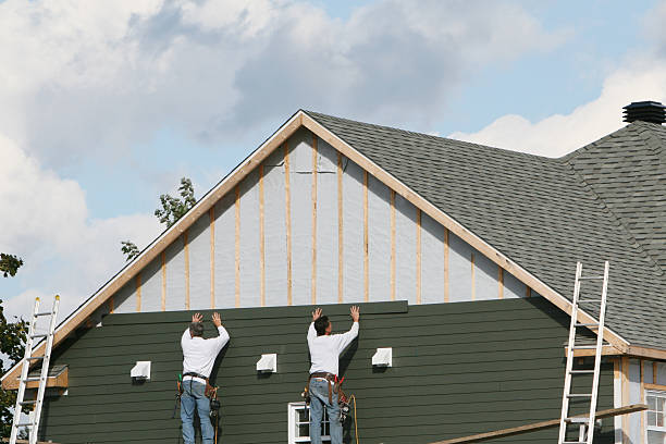 Professional Vinyl Siding technician working in Wenham, MA